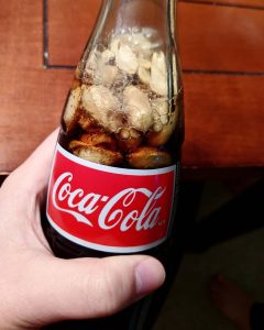 why do people put peanuts in coke