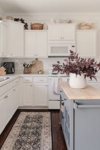how to decor empty space above kitchen cabinet