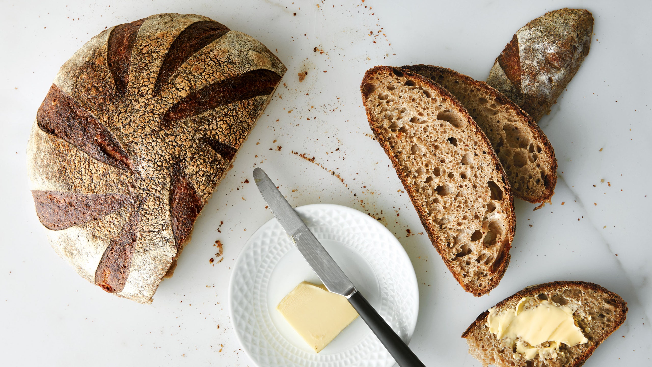 whydoesn't baking destroy sourdough bread