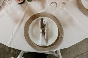 What is the difference between a charger plate and a regular dinner plate?