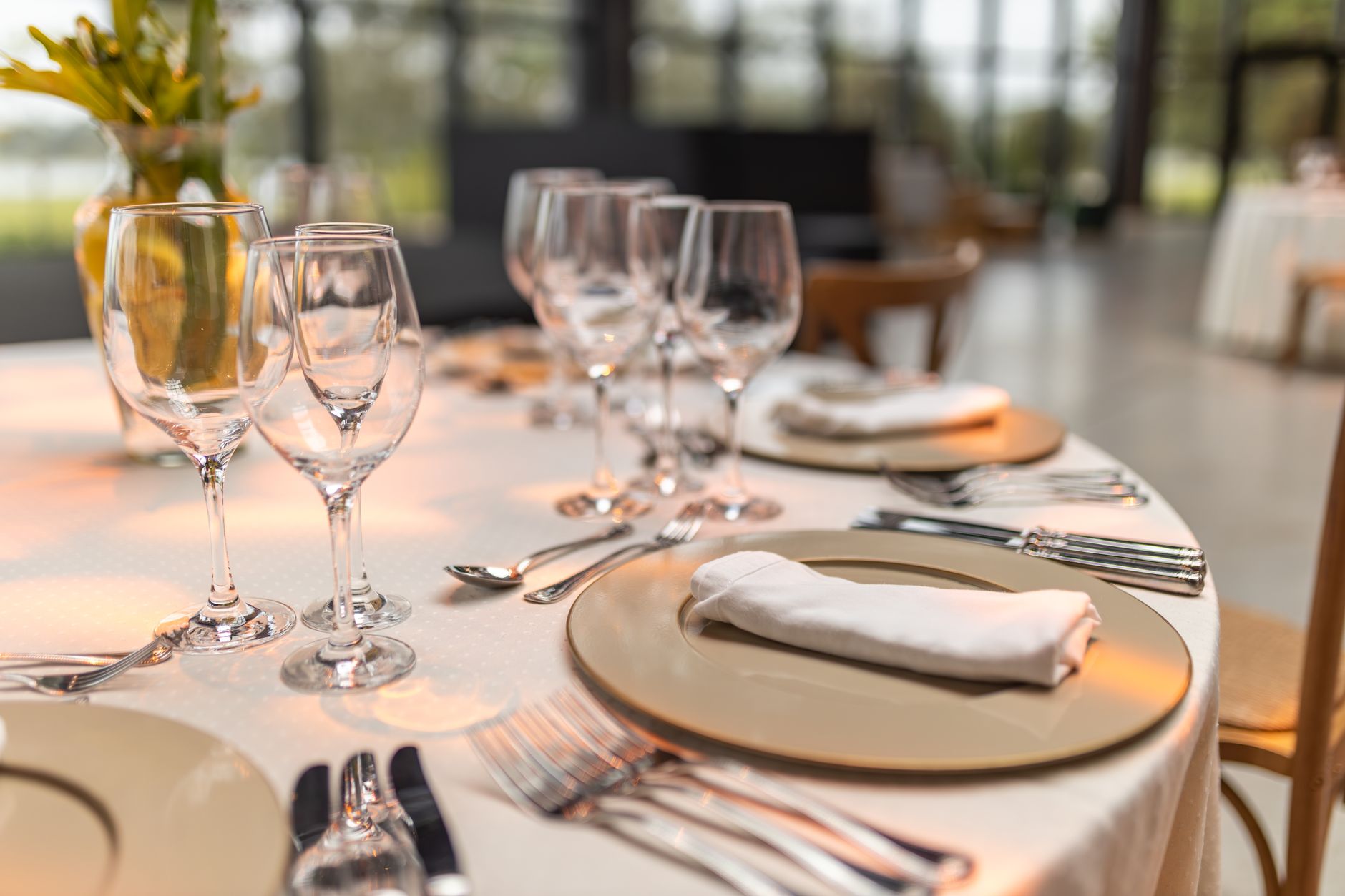 How to properly set a table for a formal three-course dinner party?