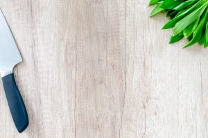 How to care for and sanitize a premium wooden chopping board to keep it looking new?