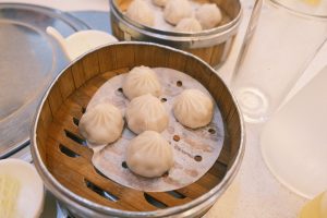 How to eat Xiao Long Bao (Soup Dumplings) properly without spilling the broth?