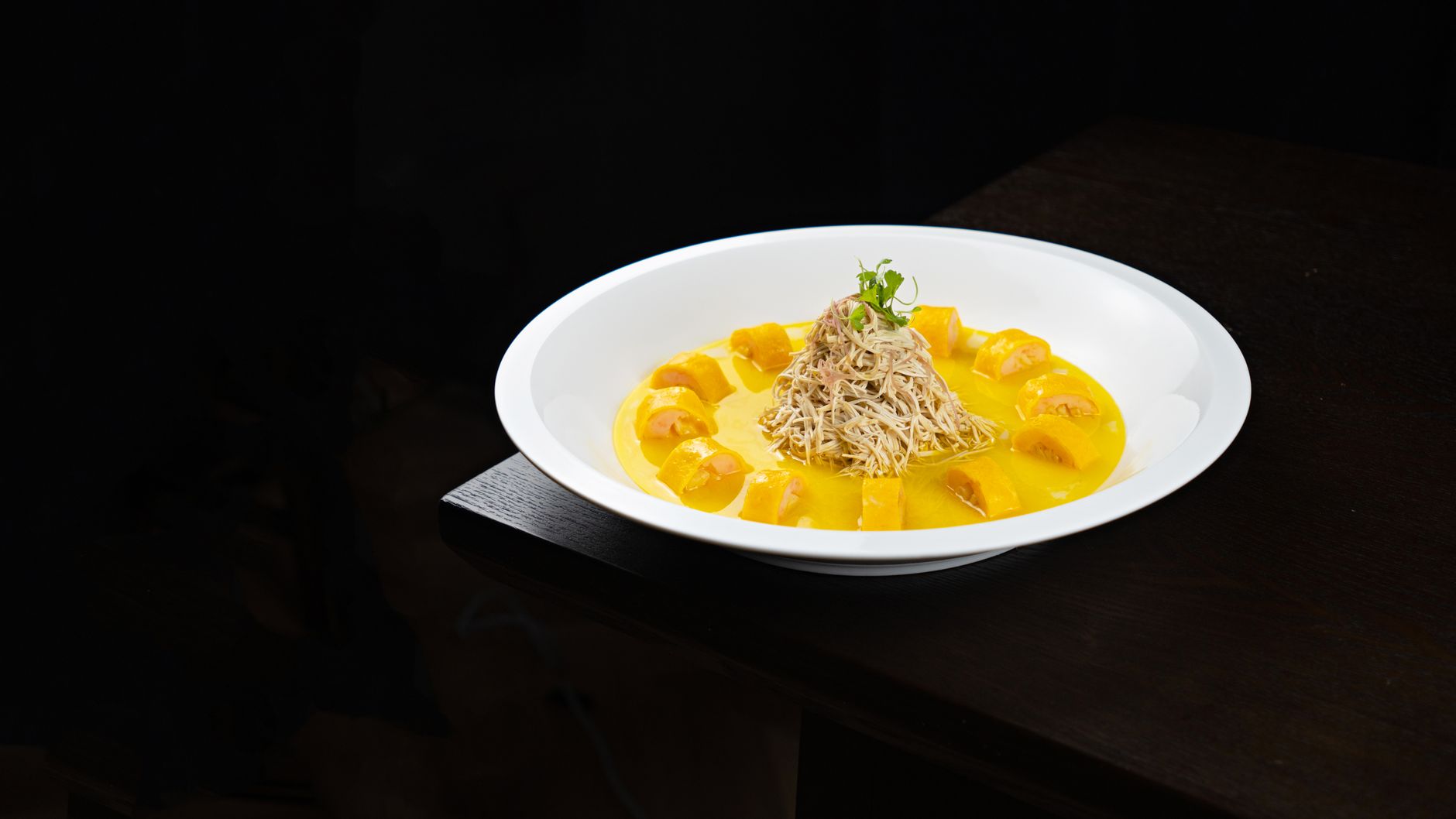 What are the best plating techniques for serving pasta in a shallow bowl?