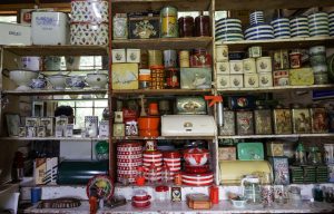 How to style and display vintage tea cake wrappings as a kitchen decor piece?
