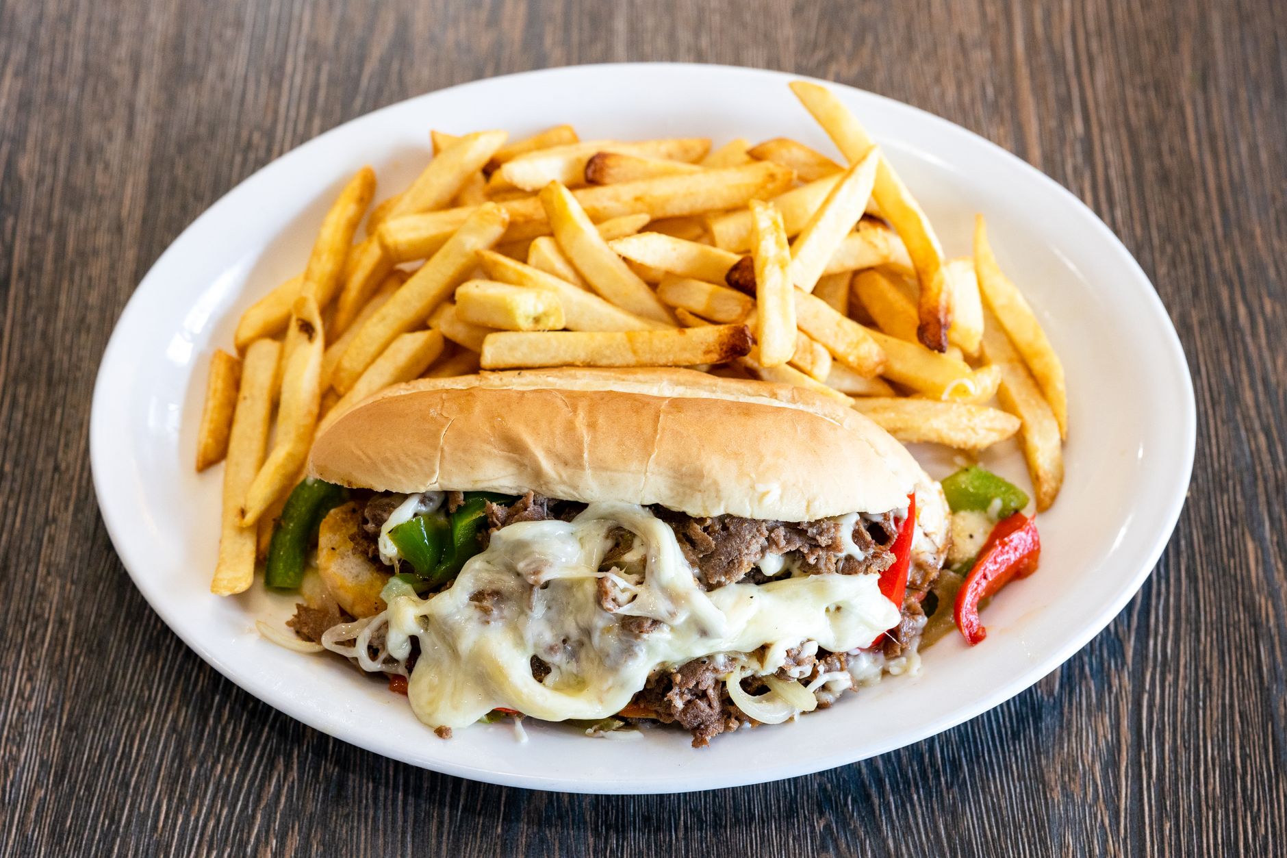 How to make authentic Philly cheesesteak at home using a cast iron griddle?