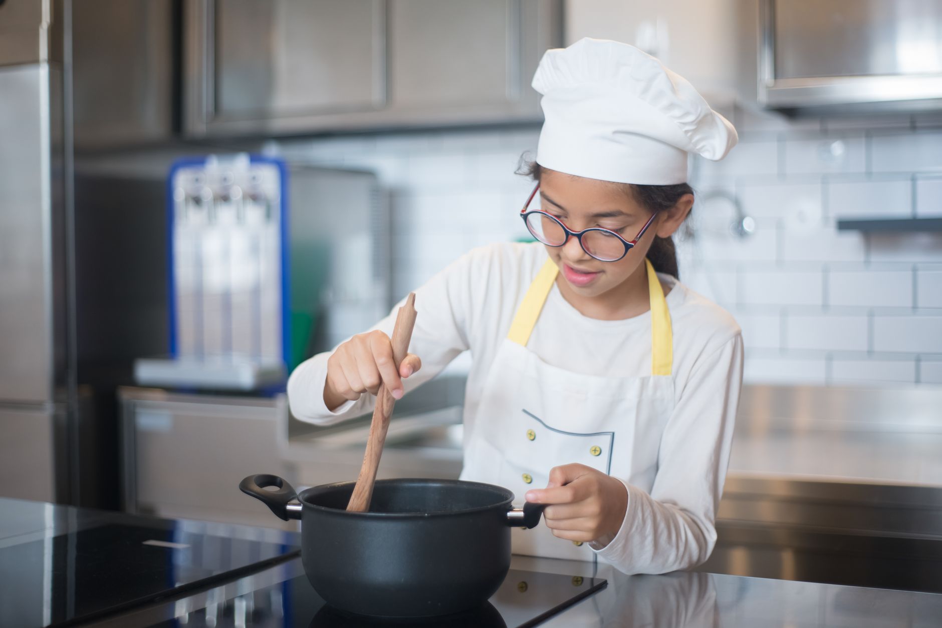 Why do professional chefs always wear those tall white hats called toques?