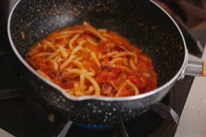 What is the fastest way to save a greasy or broken spaghetti sauce?