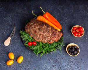 What is a Mississippi pot roast and why is it cooked with pepperoncini peppers?