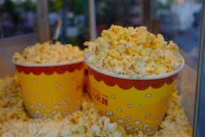 What is the secret to making movie theater popcorn at home extra buttery?