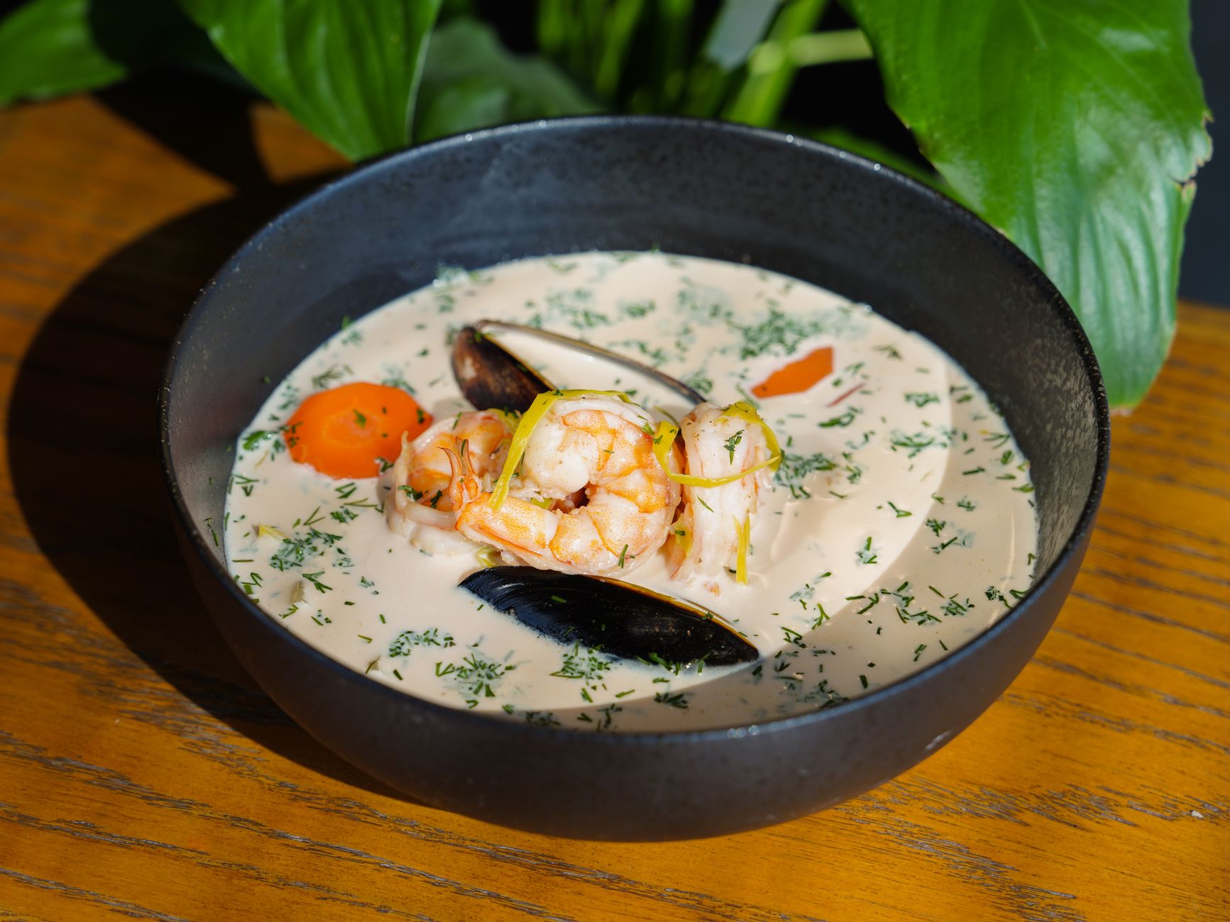 What is a New England clam chowder and how do you make it thick and creamy?