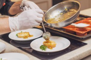 Why do restaurants add so much butter and salt to dishes compared to home cooking?